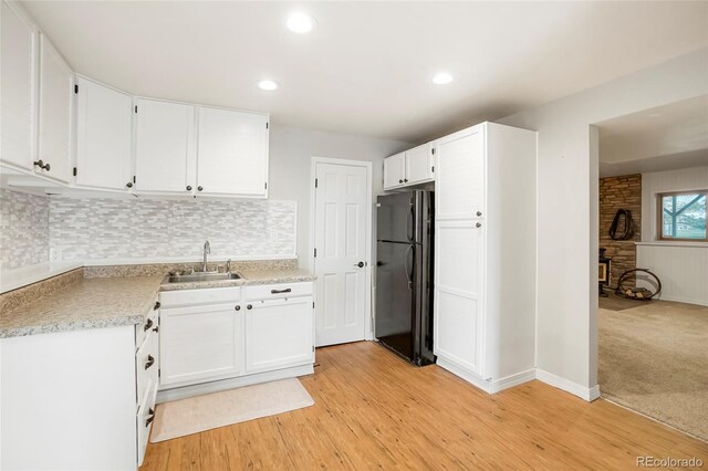 41504 Vista Rdg, Parker, CO 80138 - kitchen featuring freestanding refrigerator, a sink, white cabinetry, and recessed lighting