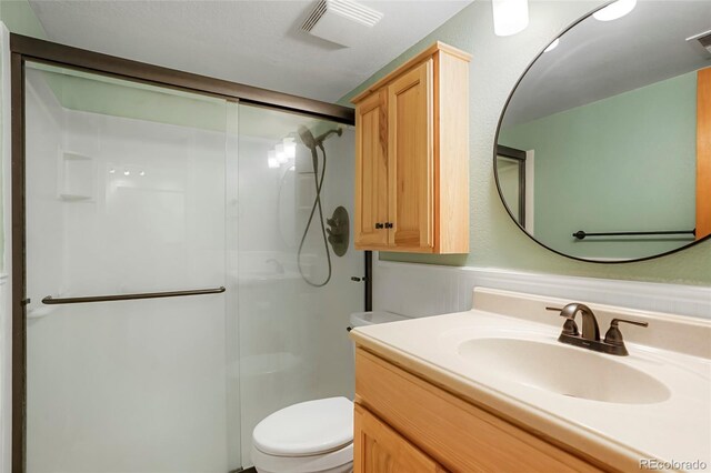 41504 Vista Rdg, Parker, CO 80138 - bathroom featuring a stall shower, toilet, and vanity