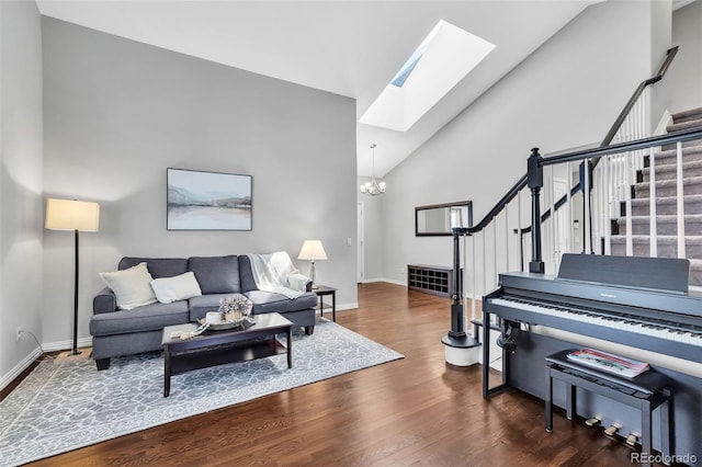 16655 W 2nd Ave, Golden, CO 80401 - living room with a skylight, wood finished floors, an inviting chandelier, and stairway