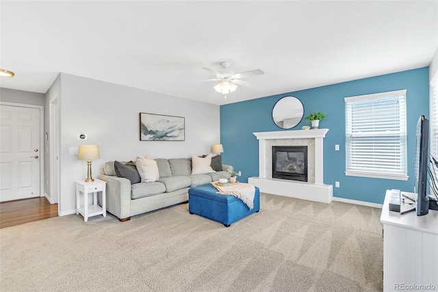 16655 W 2nd Ave, Golden, CO 80401 - carpeted living room with ceiling fan, baseboards, and a high end fireplace