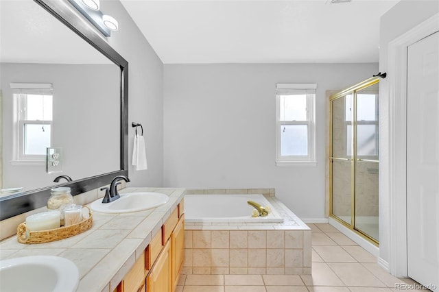 16655 W 2nd Ave, Golden, CO 80401 - full bathroom with tile patterned floors, a sink, plenty of natural light, and a stall shower