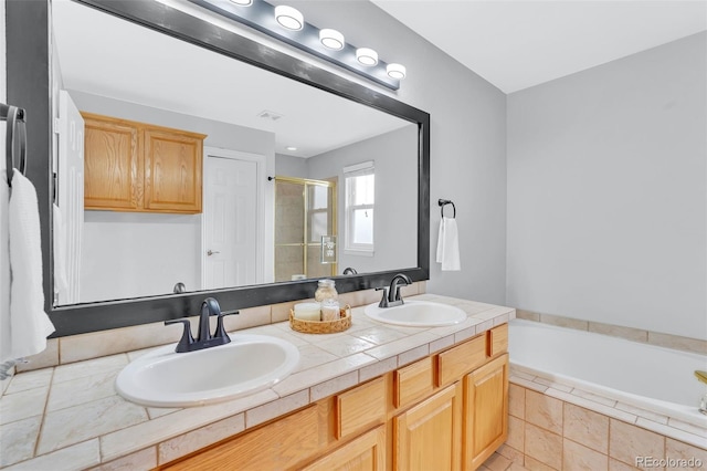 16655 W 2nd Ave, Golden, CO 80401 - full bathroom with a garden tub, a sink, a shower stall, and double vanity