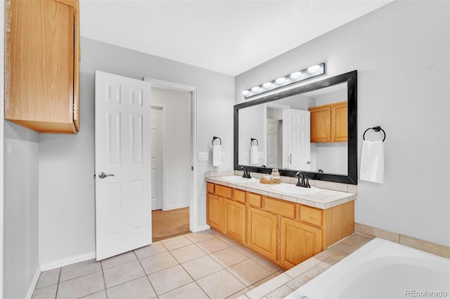 16655 W 2nd Ave, Golden, CO 80401 - full bath with baseboards, tile patterned floors, a sink, and double vanity
