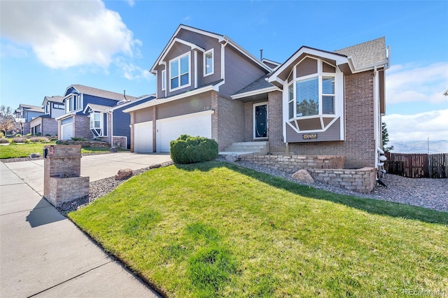 16655 W 2nd Ave, Golden, CO 80401 - view of front of home featuring an attached garage, concrete driveway, a front lawn, and fence