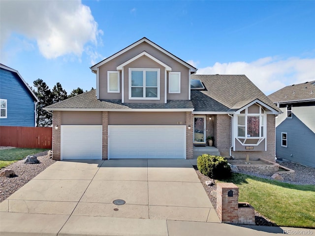 16655 W 2nd Ave, Golden, CO 80401 - view of front of house featuring driveway, a shingled roof, fence, a front yard, and brick siding