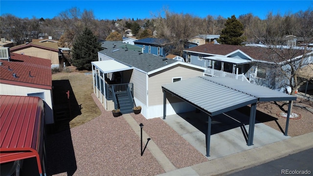 birds eye view of property with a residential view