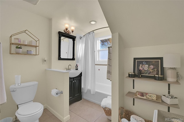 full bathroom featuring toilet, tile patterned flooring, sink, and shower / tub combo with curtain