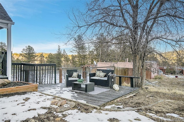 snow covered deck with outdoor lounge area