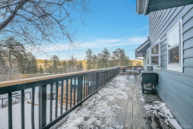 view of snow covered deck