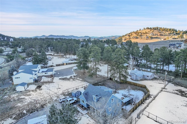 snowy aerial view featuring a mountain view