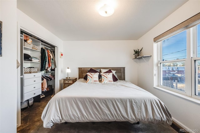 carpeted bedroom with a closet