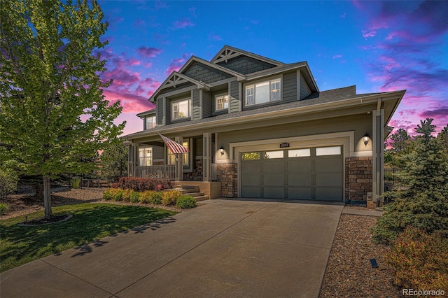 26004 E Elmhurst Pl, Aurora, CO 80016 - craftsman inspired home with covered porch, concrete driveway, stone siding, a front lawn, and an attached garage