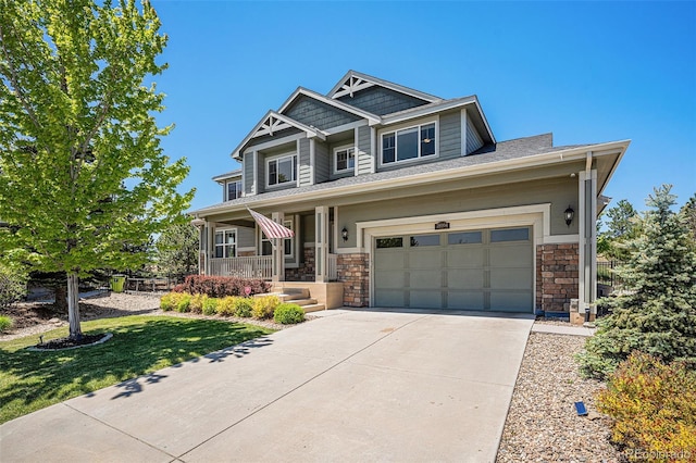 26004 E Elmhurst Pl, Aurora, CO 80016 - craftsman-style house featuring covered porch, concrete driveway, stone siding, a front lawn, and an attached garage