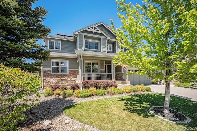 26004 E Elmhurst Pl, Aurora, CO 80016 - craftsman inspired home featuring covered porch, stone siding, driveway, solar panels, and a front yard