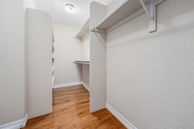 26004 E Elmhurst Pl, Aurora, CO 80016 - walk in closet featuring wood finished floors