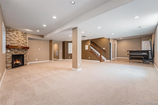 26004 E Elmhurst Pl, Aurora, CO 80016 - unfurnished living room with light colored carpet, stairway, recessed lighting, baseboards, and a stone fireplace