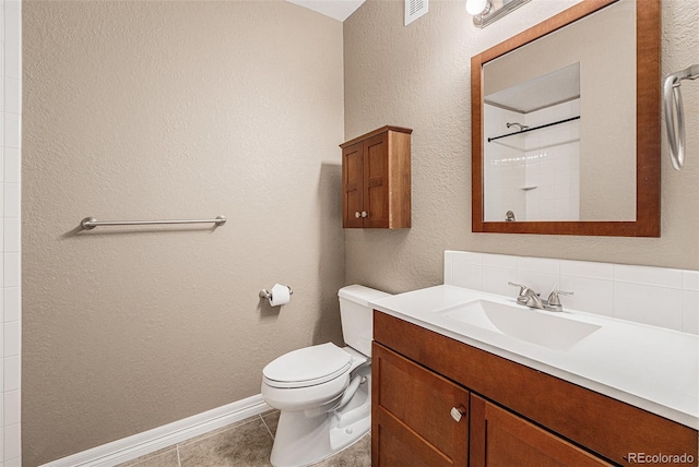 26004 E Elmhurst Pl, Aurora, CO 80016 - full bath with toilet, vanity, tile patterned floors, baseboards, and a shower
