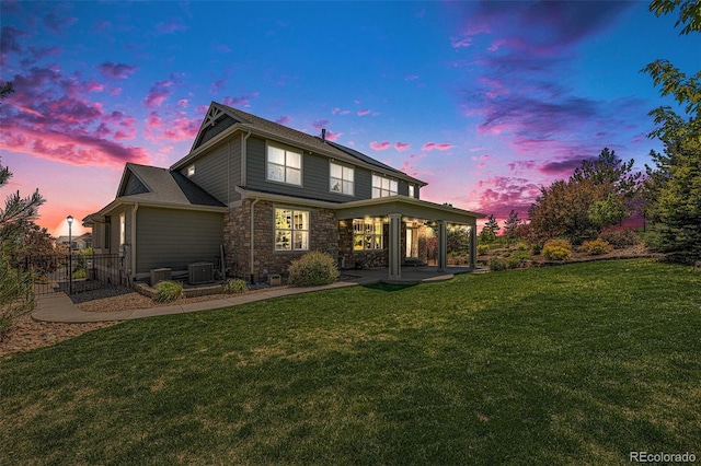 26004 E Elmhurst Pl, Aurora, CO 80016 - back of house with a patio, central air condition unit, and stone siding