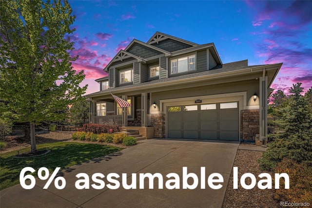 26004 E Elmhurst Pl, Aurora, CO 80016 - craftsman inspired home featuring a porch, driveway, and stone siding