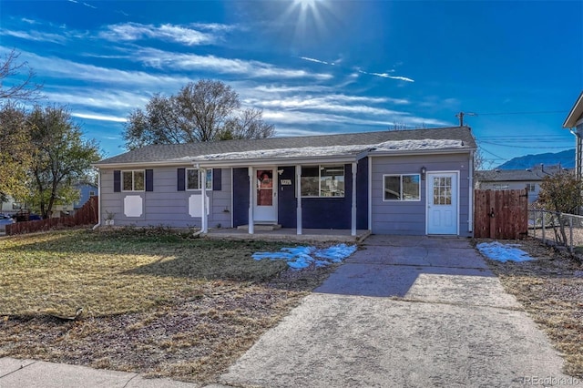 ranch-style home featuring a front yard