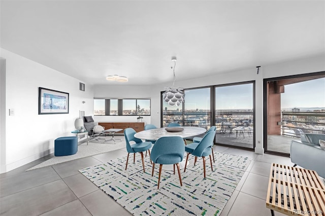 dining area with plenty of natural light and baseboards