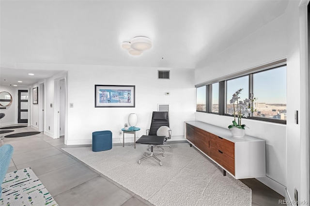 sitting room featuring visible vents and baseboards