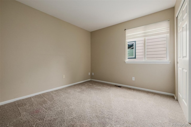 9417 Burgundy Cir, Highlands Ranch, CO 80126 - carpeted empty room featuring baseboards