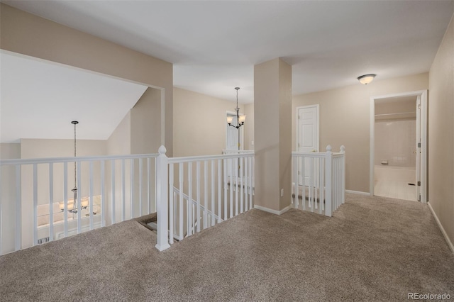 9417 Burgundy Cir, Highlands Ranch, CO 80126 - hallway featuring carpet flooring, an upstairs landing, and a chandelier
