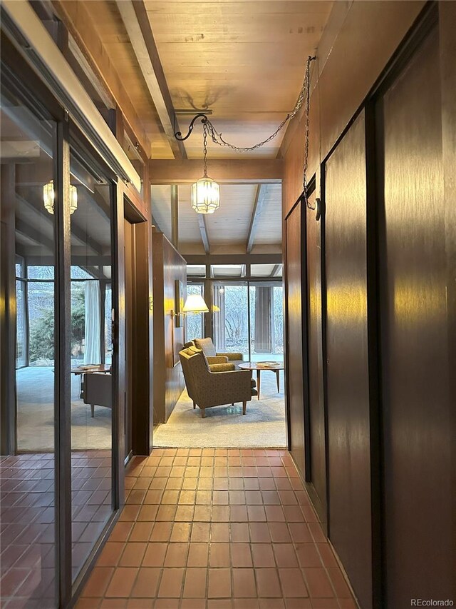 hall featuring wood ceiling and tile patterned floors