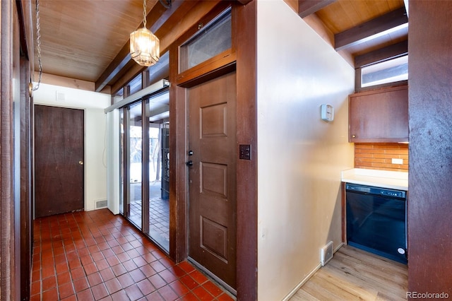 foyer entrance featuring wood ceiling and beam ceiling