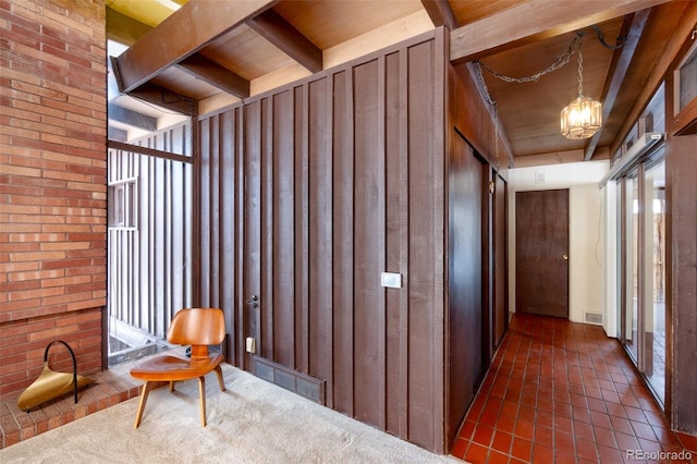 corridor with beamed ceiling, wooden ceiling, and a notable chandelier