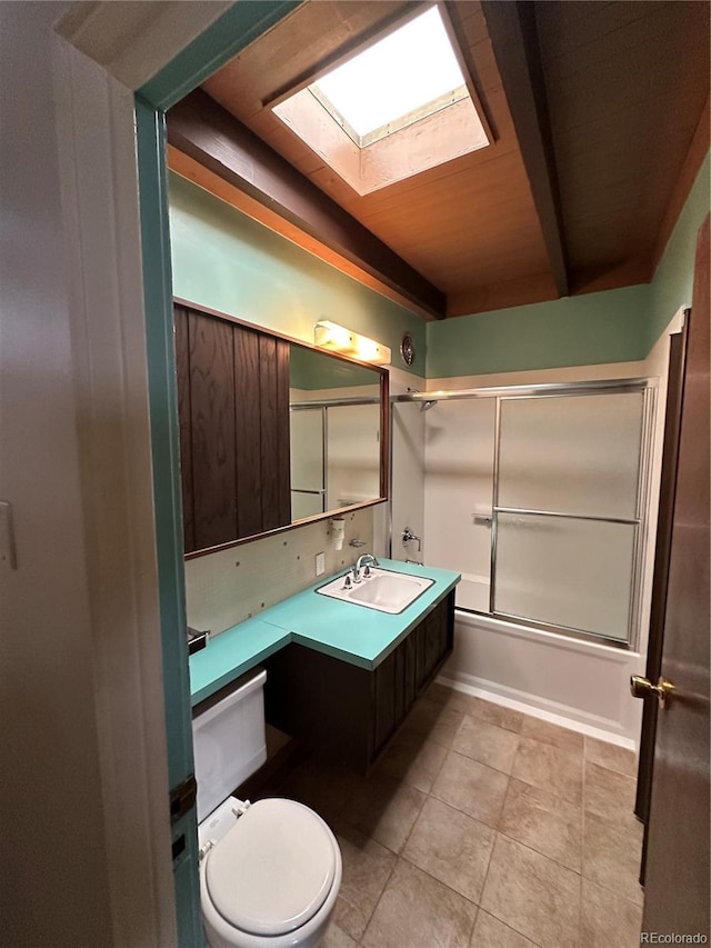 full bathroom featuring vanity, shower / bath combination with glass door, and toilet