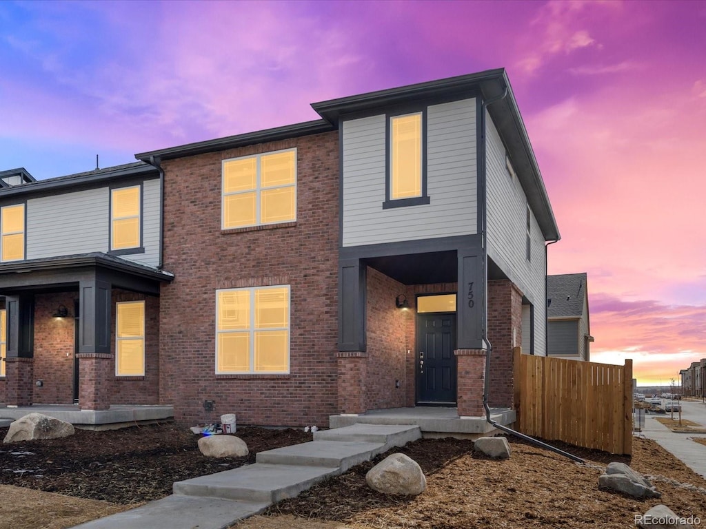 view of front of house with brick siding