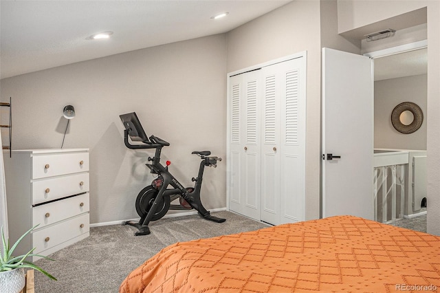 bedroom with a closet, baseboards, and carpet floors