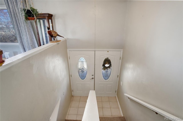 entryway featuring light tile patterned flooring