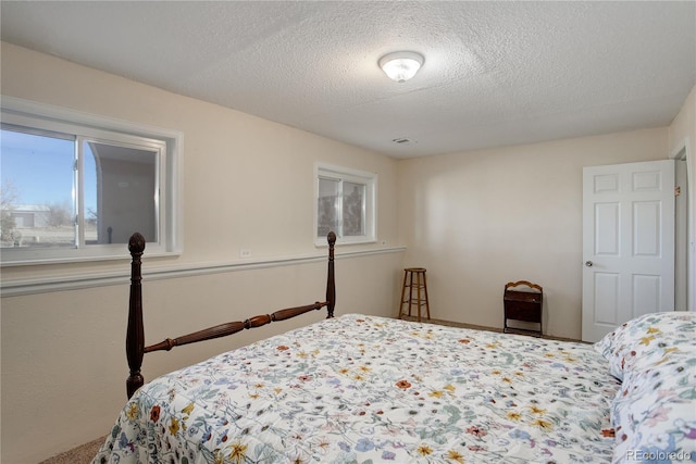 bedroom featuring a textured ceiling