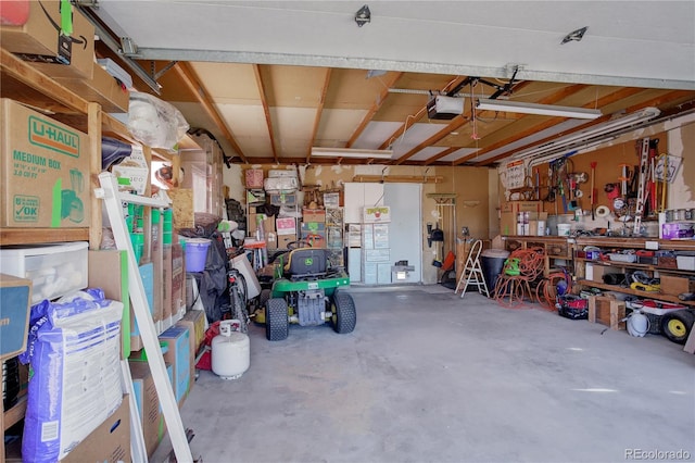 garage featuring a workshop area and a garage door opener