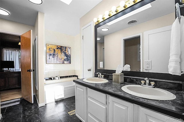 6223 W Flora Pl, Denver, CO 80227 - bathroom with double vanity and a garden tub
