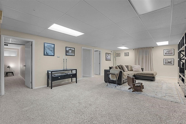 6223 W Flora Pl, Denver, CO 80227 - carpeted living room featuring a paneled ceiling and baseboards
