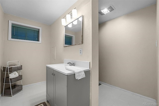 6223 W Flora Pl, Denver, CO 80227 - bathroom featuring vanity and baseboards
