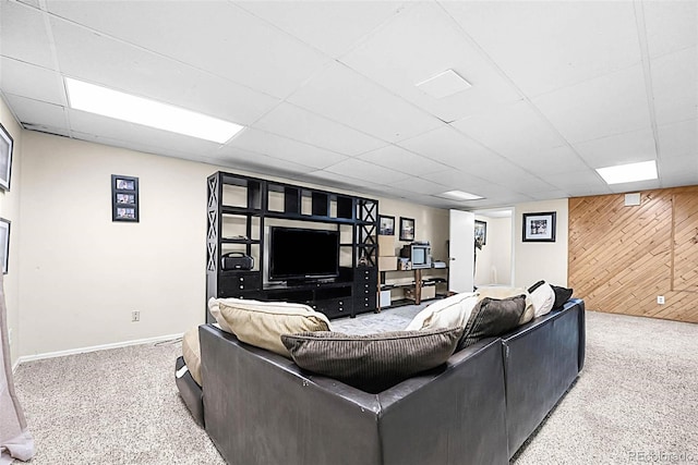 6223 W Flora Pl, Denver, CO 80227 - living area with a drop ceiling, wooden walls, baseboards, and carpet