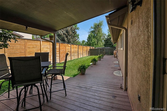 6223 W Flora Pl, Denver, CO 80227 - wooden deck with a fenced backyard and outdoor dining space