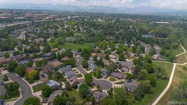 6223 W Flora Pl, Denver, CO 80227 - view of property location with a mountainous background and nearby suburban area
