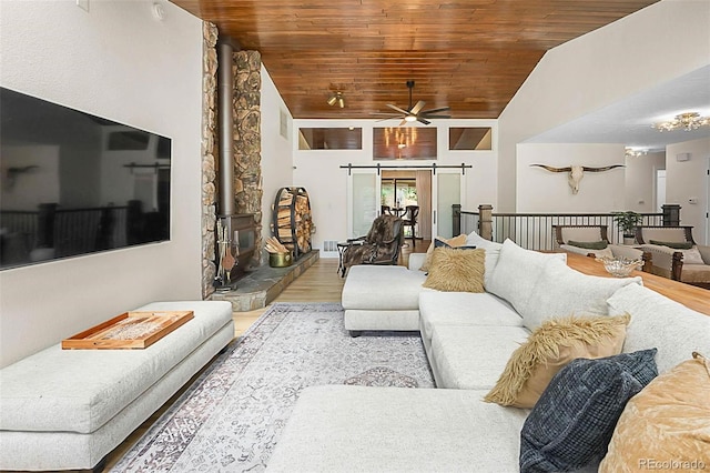 6223 W Flora Pl, Denver, CO 80227 - living area featuring lofted ceiling, wood finished floors, ceiling fan, and wood ceiling