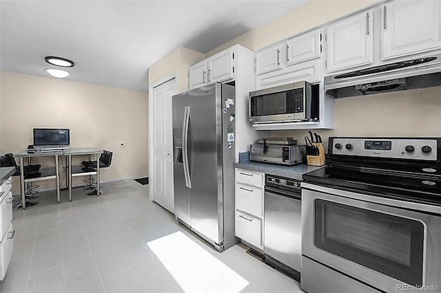 6223 W Flora Pl, Denver, CO 80227 - kitchen with appliances with stainless steel finishes, under cabinet range hood, white cabinetry, and dark countertops