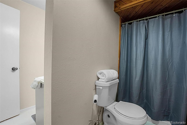 6223 W Flora Pl, Denver, CO 80227 - bathroom featuring toilet, wooden ceiling, and curtained shower