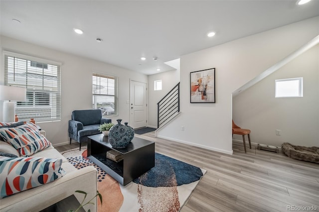 13029 E 103rd Pl, Commerce City, CO 80022 - living room featuring stairs, light wood-style floors, recessed lighting, and baseboards