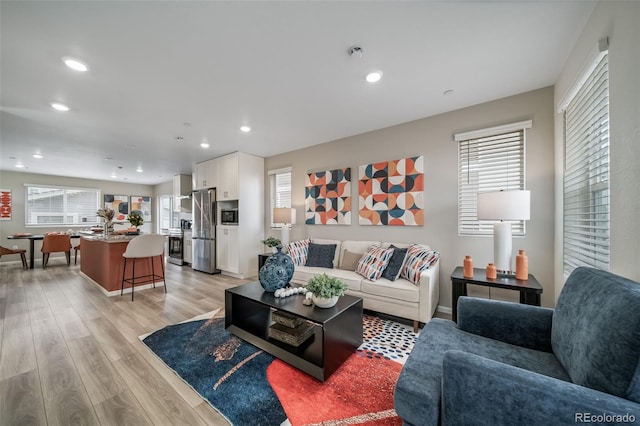 13029 E 103rd Pl, Commerce City, CO 80022 - living room with light wood-style floors, recessed lighting, and baseboards