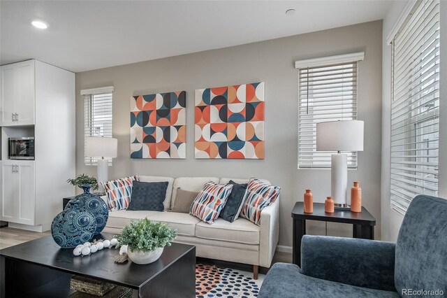 13029 E 103rd Pl, Commerce City, CO 80022 - living area featuring recessed lighting, wood finished floors, and baseboards