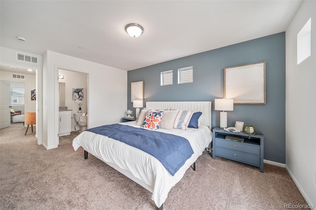 13029 E 103rd Pl, Commerce City, CO 80022 - carpeted bedroom with multiple windows, baseboards, and ensuite bathroom